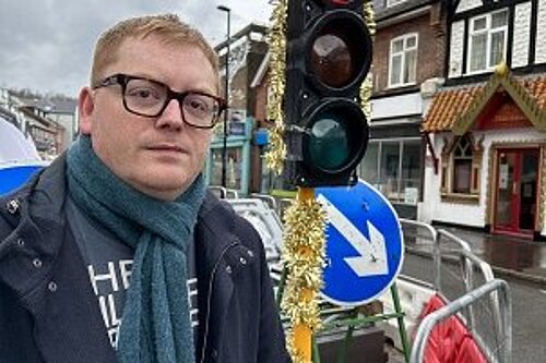 Alun Jones with tinsel covered traffic light