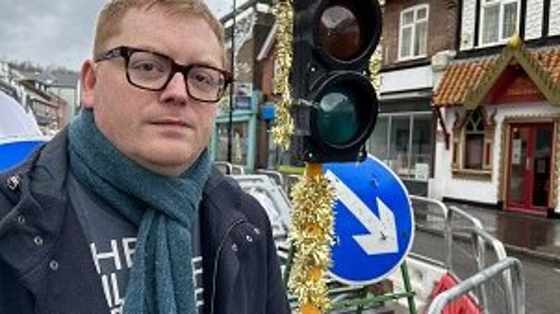 Alun Jones with tinsel covered traffic light